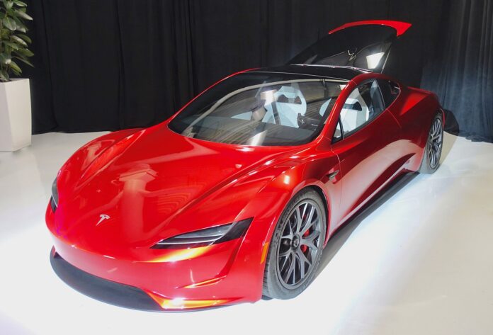 Tesla’s New Roadster Flips in Midair. What the Viral Demo Showed, What It Costs and What’s Still Unknown